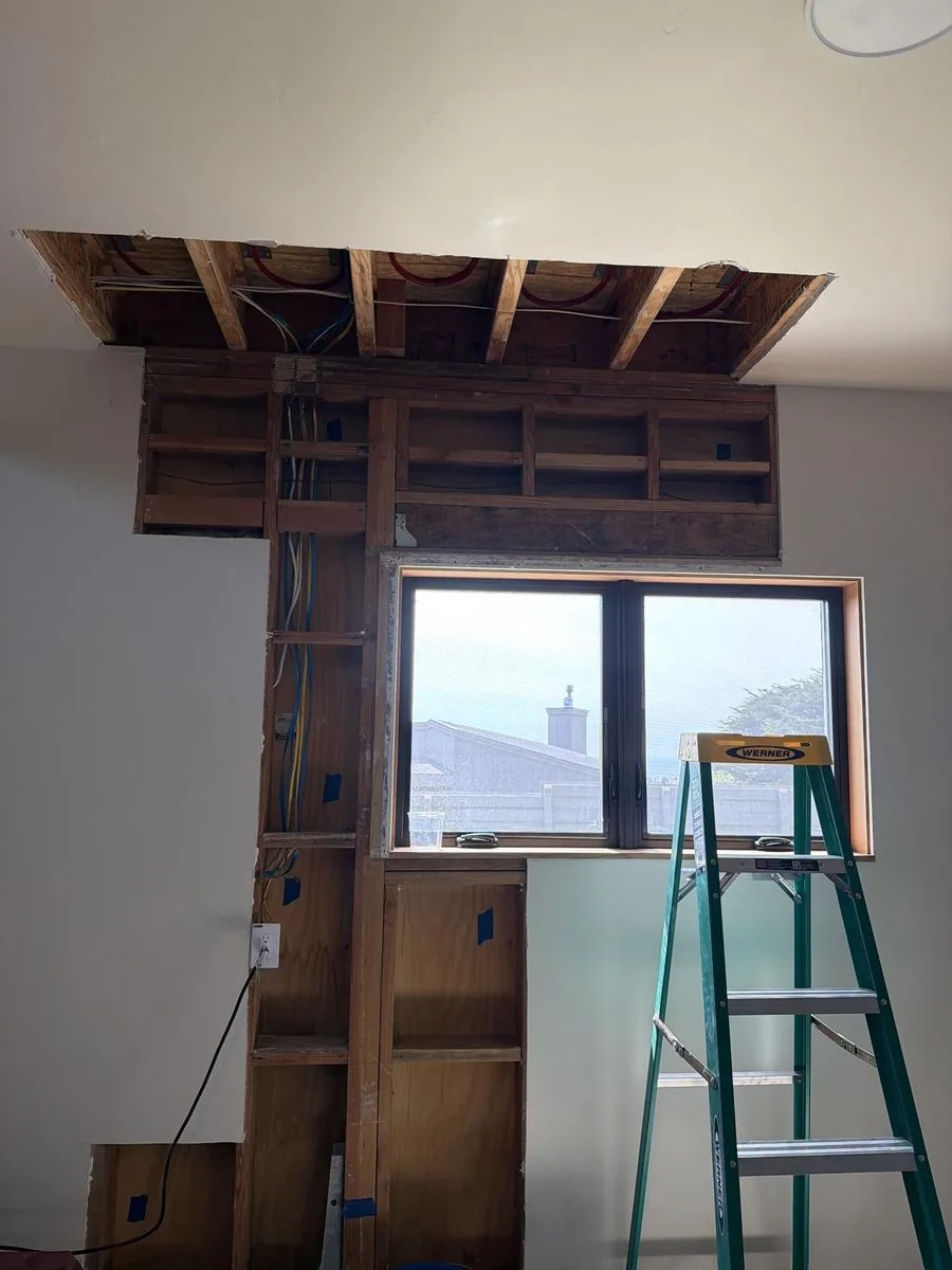 Ceiling and wall opened for structural drying after water damage at Sea Ranch